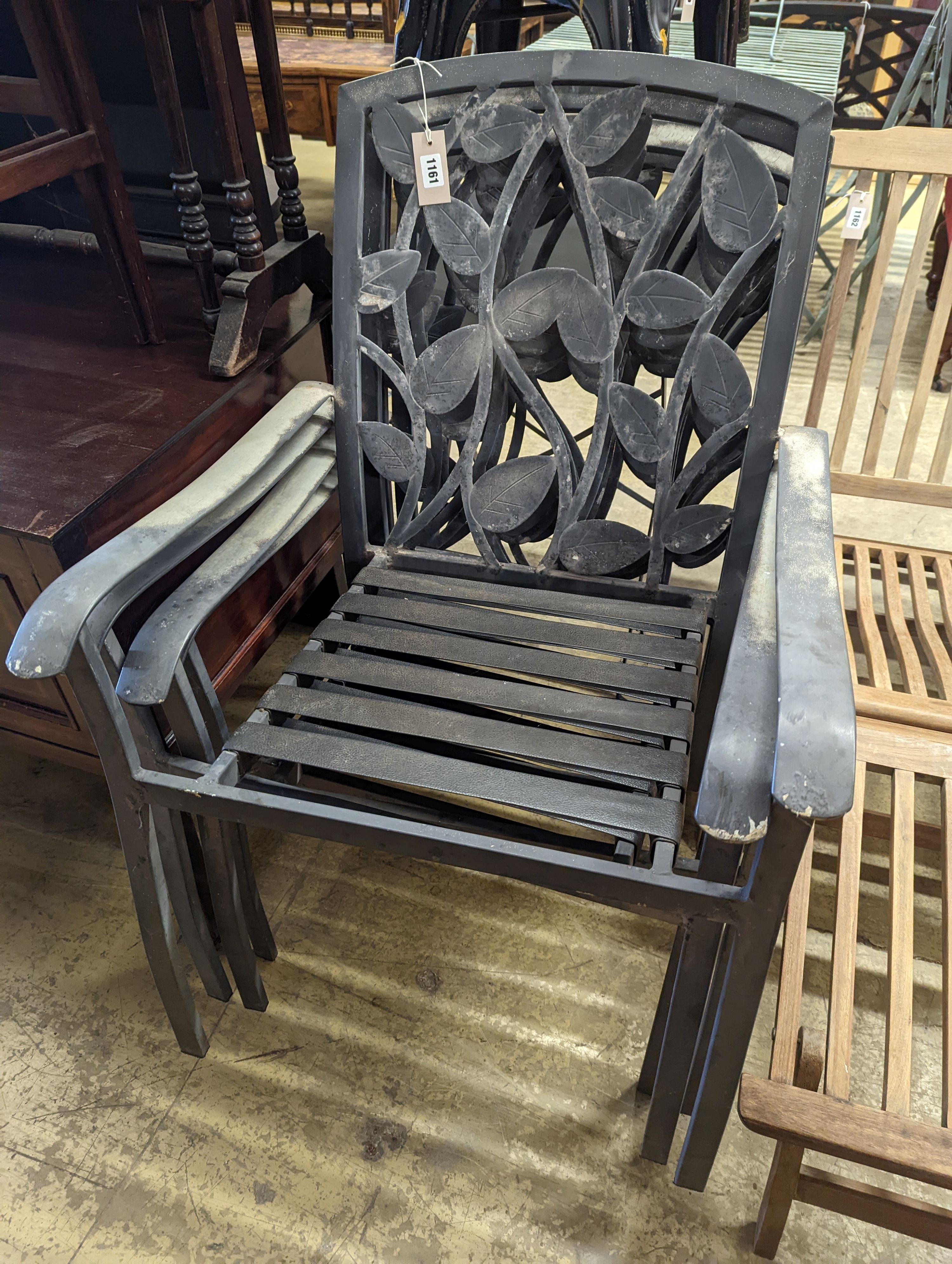 A set of four aluminium garden elbow chairs, width 62cm, depth 50cm, height 94cm